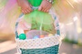 Girl's hands holding an Easter basket