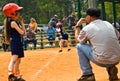 Girl's Softball Runner and Coach