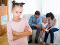 Girl sad because of jealous younger sister to parents Royalty Free Stock Photo