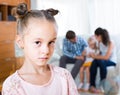 Girl sad because of jealous younger sister to parents Royalty Free Stock Photo