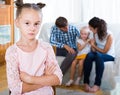 Girl sad because of jealous younger sister to parents Royalty Free Stock Photo