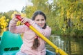 A girl is sailing in a boat in the autumn park Royalty Free Stock Photo