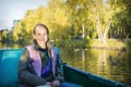 A girl is sailing in a boat in the park Royalty Free Stock Photo