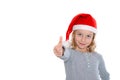 Girl with Santa- cap and thumb up Royalty Free Stock Photo