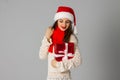 Girl in santa hat with gift Royalty Free Stock Photo