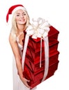 Girl in santa hat holding stack gift box. Royalty Free Stock Photo