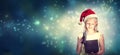 Girl with Santa Hat Opening Gift Box Royalty Free Stock Photo