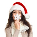 Girl in santa hat portrait with snowflake posing on white background, christmas holiday concept, happy and emotions Royalty Free Stock Photo
