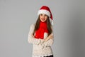 Girl in santa hat and red scarf Royalty Free Stock Photo