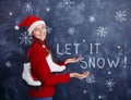 Girl With Santa Hat with Snow Royalty Free Stock Photo