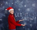 Girl With Santa Hat with Snow Royalty Free Stock Photo