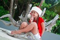 Girl on Santa's hat making silence gesture Royalty Free Stock Photo