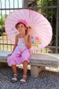 Girl in sarafan sitting on bench Royalty Free Stock Photo