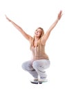 Girl on scales celebrating weightloss Royalty Free Stock Photo