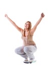 Girl on scales celebrating weightloss Royalty Free Stock Photo