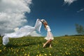 Girl with scarf in dandelion field Royalty Free Stock Photo