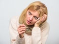 Girl in scarf hold thermometer and tissue close up. Measure temperature. Break fever remedies. Take temperature and Royalty Free Stock Photo