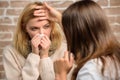 Girl in scarf hold tissue while doctor examine her. Recognize symptoms of cold. Remedies should help beat cold fast Royalty Free Stock Photo