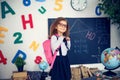 Girl with a school backpack. The concept of school, study, education, friendship, childhood. Royalty Free Stock Photo