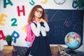 Girl with a school backpack. The concept of school, study, education, friendship, childhood. Royalty Free Stock Photo