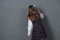 Girl in school uniform standing at the chalkboard Royalty Free Stock Photo