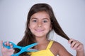 Girl with scissors ready to cut hair