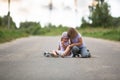 Girl scooter fell In the countryside, sister helps her child Royalty Free Stock Photo