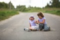 Girl scooter fell In the countryside, sister helps her child Royalty Free Stock Photo