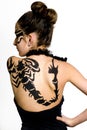 Girl with scorpio painted on back