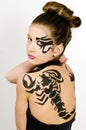 Girl with scorpio painted on back