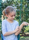 Girl Scratching itchy Eczema on Swing Royalty Free Stock Photo