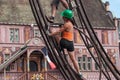 Girl Screwing a bolt at Team Extreme Workers Ride an Attraction in the City