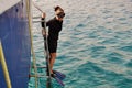 The girl in the scuba gear ready to jump in the water Royalty Free Stock Photo