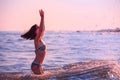 Girl in the sea splashing water