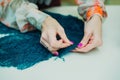 Girl seamstress working in his Studio.Learning to sew