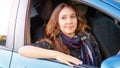 Girl seat at car. Passenger in blue wheel