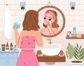 Girl self care in bathroom. Hygiene routine, cleaning and moisturize face skin. Daily makeup process, young adult or