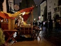 Medieval city  rainy Christmas Evening in Tallinn old town people walk on street  on front medieval red ten with for trist  medie Royalty Free Stock Photo