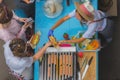 Girl seller serves customers. Sale and service with healthy vegan street food, selective focus. Top view. Healthy street