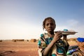 Girl selling food and water on the road to Mopti Royalty Free Stock Photo