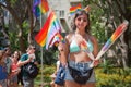 Girl selling rainbow flags at Pride Parade Royalty Free Stock Photo
