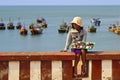 Girl selling seashells in Fishing village in Muine, Vietnam