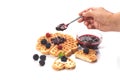 Girl served waffles with blueberry jam, Breakfast with coffee Royalty Free Stock Photo