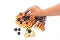 Girl served waffles with blueberry jam, Breakfast with coffee Royalty Free Stock Photo