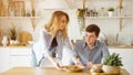 Girl serves breakfast putting dumplings on plate