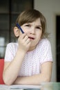 girl seven years old doing homework. Royalty Free Stock Photo