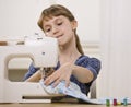 Girl on Sewing Machine Royalty Free Stock Photo