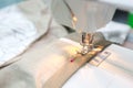 A girl sewing machine for bed sheets do it herself Royalty Free Stock Photo