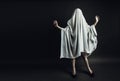 Sexy Girl with long legs in costume Spooky white ghost. Halloween minimal concept