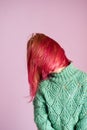 Girl shaking her Beautiful young girl with dyed hair on color backgroundpink hair Royalty Free Stock Photo